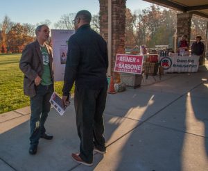 Chadds Ford Township resident Rob Gurnee, on the board of Save the Valley, talks with a voter outside the Calvary Chapel polling place on election morning.