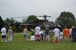 Cpl. Michael P. Becker describes the life of a state police helicopter pilot to an enthusiastic audience.