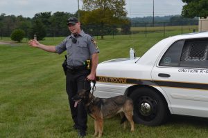 Trooper Jason Landermilch gives a K-9 demonstration during Sunny Day Camp on Saturday, Aug. 6.