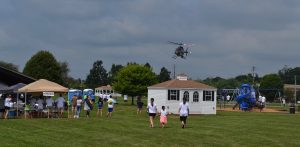 Eyes are on the sky as Cpl. Michael P. Becker does a fly-over at Sunny Day Camp.