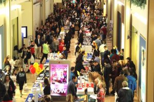 Students and families meet with college representatives during the 2015 fair.