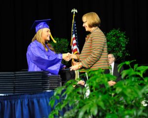 Virginia Jackson, of Chadds Ford Township, receives her diploma from UHS Principal Paula Massanari.