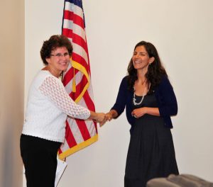 Unionville-Chadds Ford School Board President Eileen Bushelow congratulates Leticia Flores DeWilde after her swearing in.