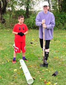 Ann and Drew DelCollo plant trees to help build a sense off community in Pennsbury Township.