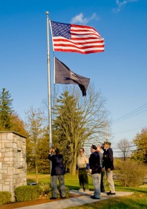 Veterans change flags at the Concord Township Veterans Memorial on Nov. 10.