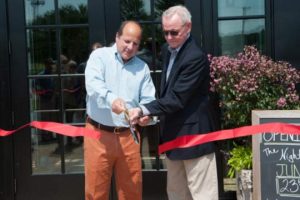 NYA Joe's owner Steve Silverstein, left, and Chadds Ford Township Supervisors' Chairman Keith Klaver, cut the ribbon to officially open the restaurant.