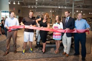 Rachelle Fletcher cuts the ceremonial ribbon at Anytime Fitness in the Garnet Valley Plaza on Route 202 in Concord Toswnship.