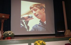 Andy Joseph, a 2011 Unionville graduate, is shown on the screen during a tribute. 