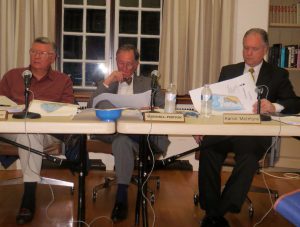 Pennsbury Township Supervisors Scotty Scottoline (from left), Wendell Fenton, and Aaron McIntyre review a zoning issue at Wednesday night's meeting.