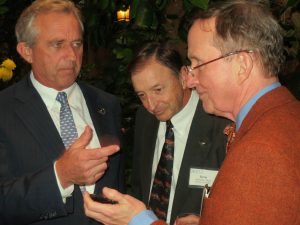 Tom Lovejoy (right) shares a cell-phone photo with Robert F. Kennedy Jr. (left) as Bern Sweeney, the director of the Stroud Water Research Center, looks on.