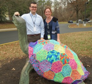 Daniel McCunney (left), the museum's communications manager, and intern Helen Bilinski show off the tortoise's new shell.