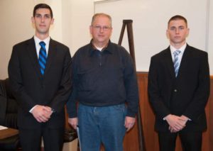 New Birmingham Township police officers John Pot, left, and Kevin Urbany, right, with  Police Chief Tom Nelling.