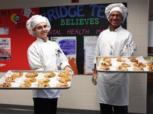 Culinary arts students from  demonstrate their skills during a fall field trip to Penn London Elementary School.