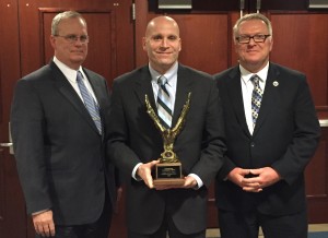 Chester County Detective Sergeant Robert J. Dougherty (from left), Chester County District Attorney Tom Hogan, and Jeremiah A. Daley, executive director of Philadelphia-Camden HIDTA display Chester County's award.
