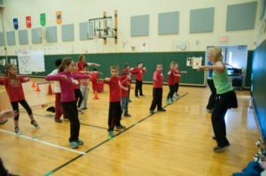 Volunteers from Livfit in Oxford get the kids moving with a Zumba lesson.