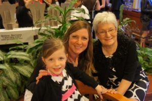 Three generations of Tick Tock supporters take a break from shopping at last year’s fundraiser. 