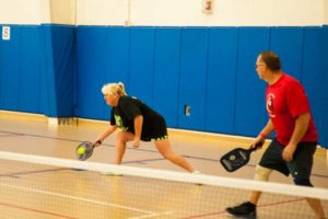 Nancy Mello, of Paso Robles, Calif., returns a ball while playing in the pickle ball tournament at the O'Donighue Fieldhouse.