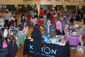 Vendors and shoppers pack the Pocopson Elementary School gymnasium during the school's annual Art and Garden Sale.