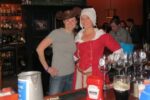 Getting into the spirit of the fundraiser for the Chadds Ford Historical Society, Victoria Browning Wyeth borrows a hat to pose with Sara Liberace behind the bar at the Brandywine Brewing Company Tavern and Grill.