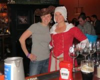Getting into the spirit of the fundraiser for the Chadds Ford Historical Society, Victoria Browning Wyeth borrows a hat to pose with Sara Liberace behind the bar at the Brandywine Brewing Company Tavern and Grill.