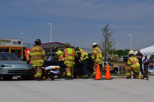 First-responders combine efforts to extricate a victim from a mangled vehicle in this training regimen.
