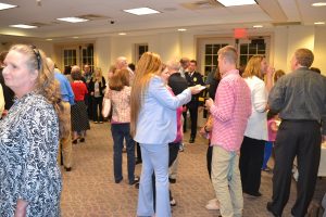 Attendees at the sendoff for former Kennett Township Police Chief Albert J. McCarthy mingle after the formal presentation of his retirement badge.