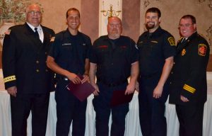 EMS Council Vice-president John Applegate (left) and EMS Council President Keith Johnson celebrate the awards of  James Forwood (from left), Sam Broomall, and Matthew Eick. 