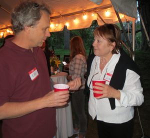 Linda Kaat (right), an area preservationist,  chats with a guest at the fundraiser for the Strode's Mill property on the northeast corner of Birmingham Road and Route 52.