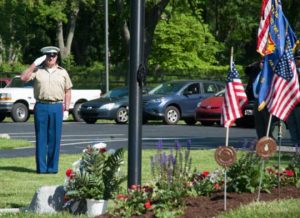 Jess Cheney, a member of the honor guard, offers a salute to the fallen during the Memorial Day ceremony at Brandywine Baptist Church.