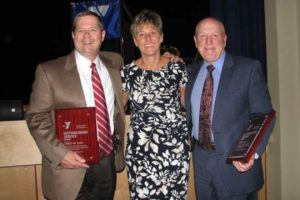 YMCA of Greater Brandywine CEO Denise Day honors Rip Tilden (left) and Joe Viscuso (right) with the 2014 Distinguished Service Award.