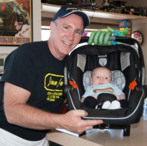 Even Roger Steward's 2-month-old grandson Mason Basinger is celebrating with his hotdog shirt.