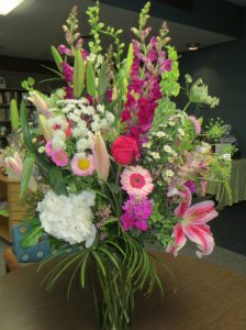 During the grand reopening of the renovated current facility on Thursday night, a beautiful floral display greets visitors. It was sent by the library board to the staff, the director said.