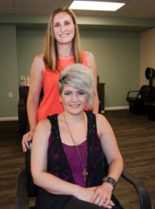 Sisters Kristin Totoro, standing, and Nikki Talarovich are the owners and operators of Salon Sestra, which opened June 16 in Olde Ridge Village.