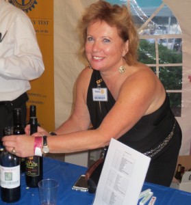 Deb Love, a Rotary member who also served as a judge for Twisted Vintner, demonstrates her wine-pouring prowess.