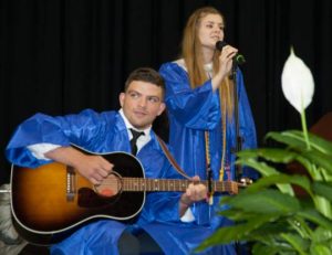 Graduates Julia Madrak and Ian Larson perform an original an original number during the UHS  graduation at the Bob Carpenter Center on June 9.