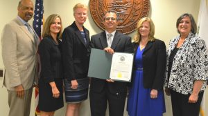Joined by the Chester County commissioners, Chris Murphy, who heads the county's Probation Department celebrates the proclamation for Pretrial, Probation and Parole Week with members of his staff Wendy Baigis (left) and Lizanne Redmond, 
