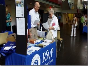 At a recent pre-retirement expo, RSVP representatives tout the benefits of volunteering.
