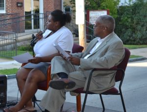 Zanyla Mitchell, a high school student and neighborhood leader, and Kennett Square Borough Council President Leon Spencer share co-hosting duties during Kennett Square's National Night Out festivities.  