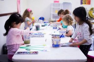 Matilda Duong (left) of Garnet Valley and Aarika Patel (right) of Glen Mills join other preschool students for  a visual arts activity. Photo courtesy of Evan Chapman