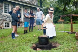 Candle-making is demonstrated on the lawn in front of the John Chad House.