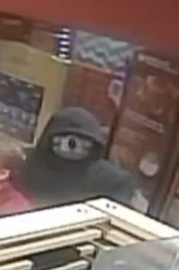 The suspect wearing a ski mask  with a skull face.