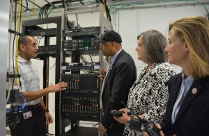 Prem Kumar (from left), project manager for Harris Corporation, explains the field acceptance test process for Chester County’s new public safety communication system to Chester County Commissioners Terence Farrell, Kathi Cozzone and Michelle Kichline.