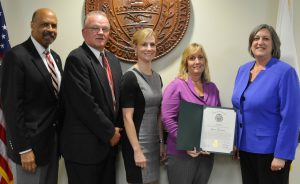 Sherry N (holding citation, Chester County Youth Center's , is joined by Chester County Commissioners' Chairman Terence Farrell, Youth Center Director Gary Blair, and Commissioners Michelle Kichline and Kathi Cozzone.
