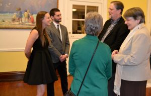 Victoria Wyeth (left), with her cousin Ryan Gleklen at her side, chats with guests before the lecture at Westtown Schoo.
