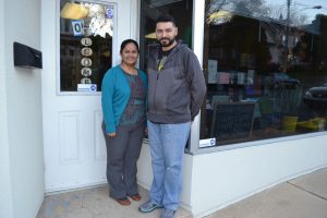 Sandy Tapia (left) and Luis Ortiz stands outside S&L Services, a printing and copying business they started in Kennett Square in August.