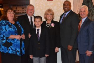 Leslie Collins (from left), Harry McKinney, Alex Collins and Chester County Sheriffs Carolyn 'Bunny ' Welsh and Alex Underwood, and Youth Mentoring Partnership Director Mark convene at the awards ceremony