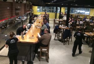 The mezzanine of the Parkesburg brewpub features high-top tables made from reclaimed oak.