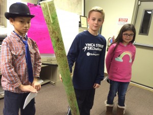 Pocopson Elementary fourth-graders Chi Xu (from left), Josiah Hoopman, and Chi Xu give Pocopson's supervisors insight into problems with the tubes used to protect tree saplings.
