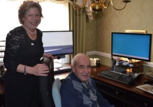 Mary Sue Boyle (left), visits with Frank Pedicone, assessing his needs needs