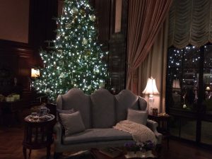 The Music Room inside the conservatory features two large trees decorated 